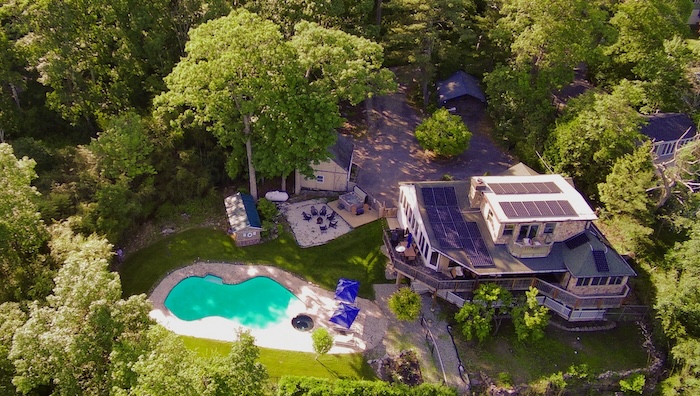 Aerial view of the house, heated pool and fire pit