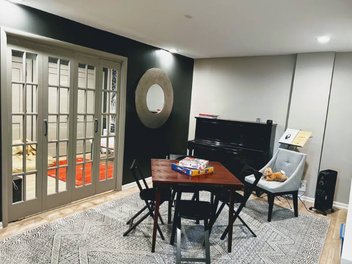 Downstairs game room with card table and french doors
